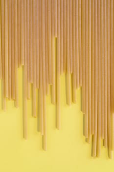 Dried pasta spaghetti , long and thin solid cylindrical pasta , abstract effect
