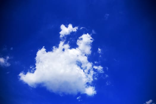 White cloud on the blue sky with color background.