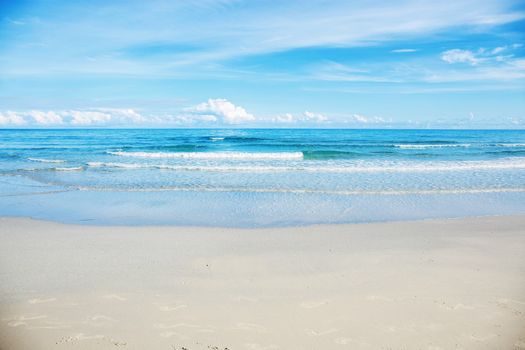 White of sand beach at sea with the blue sky.