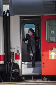 terni,italy november 03 2020:Railway controller wearing medical mask due to corona virus