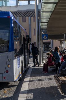 terni,italy november 03 2020:people at the station wait for the bus with a medical mask due to corona virus