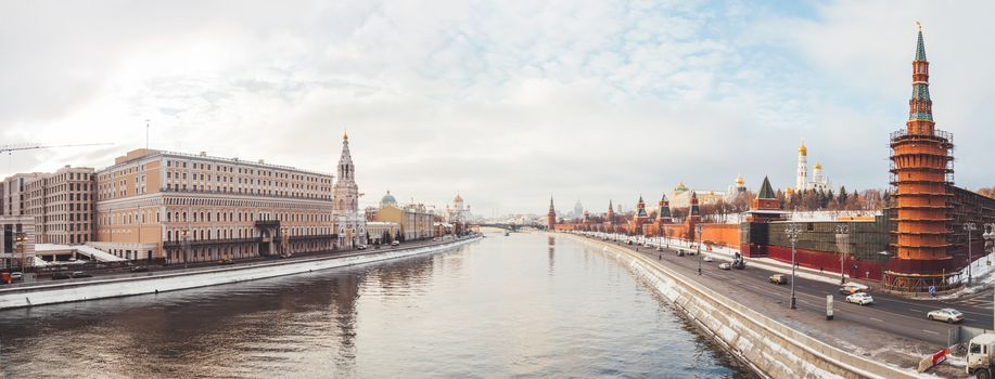 Panorama view of Moscow-river, Kremlin, Ivan the Great Bell tower, Grand Kremlin Palace, Cathedral of the Annunciation. Winter cloudy day in Moscow, Russia.