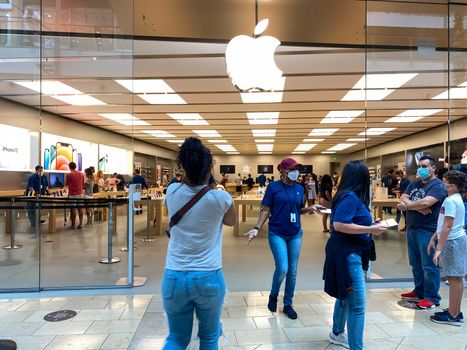 Orlando, FL/USA - 10/25/20: People waiting in line at the Apple retail store to look at and possibly purchase the new iPhone 12 and 12 Pro smartphones in Orlando, Florida.