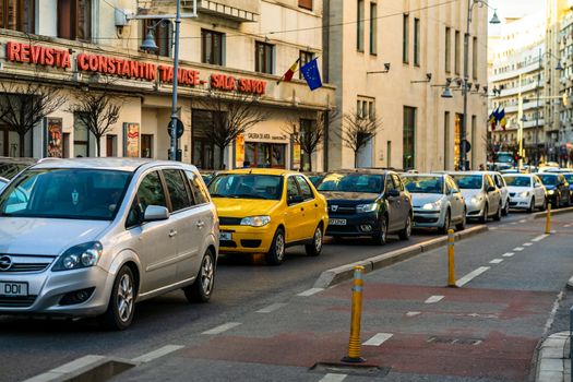 Car traffic at rush hour in downtown area of the city. Car pollution, traffic jam in the morning and evening in the capital city of Bucharest, Romania, 2020