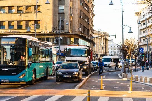 Car traffic at rush hour in downtown area of the city. Car pollution, traffic jam in the morning and evening in the capital city of Bucharest, Romania, 2020