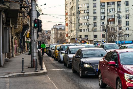 Car traffic at rush hour in downtown area of the city. Car pollution, traffic jam in the morning and evening in the capital city of Bucharest, Romania, 2020