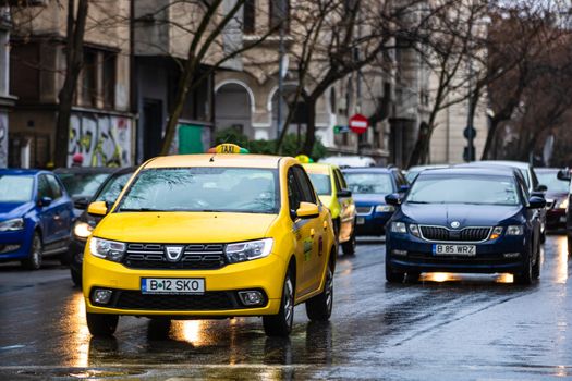 Car traffic at rush hour in downtown area of the city. Car pollution, traffic jam in the morning and evening in the capital city of Bucharest, Romania, 2020