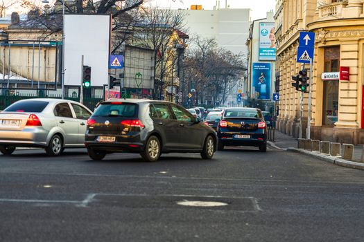 Car traffic at rush hour in downtown area of the city. Car pollution, traffic jam in the morning and evening in the capital city of Bucharest, Romania, 2020