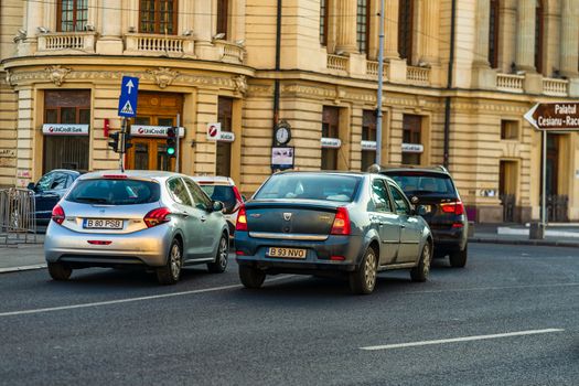 Car traffic at rush hour in downtown area of the city. Car pollution, traffic jam in the morning and evening in the capital city of Bucharest, Romania, 2020