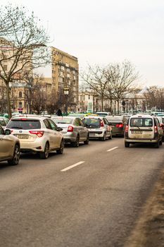 Car traffic at rush hour in downtown area of the city. Car pollution, traffic jam in the morning and evening in the capital city of Bucharest, Romania, 2020