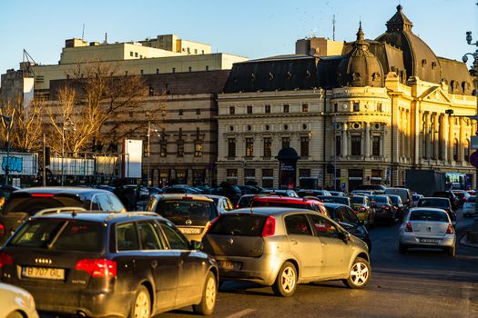 Car traffic at rush hour in downtown area of the city. Car pollution, traffic jam in the morning and evening in the capital city of Bucharest, Romania, 2020