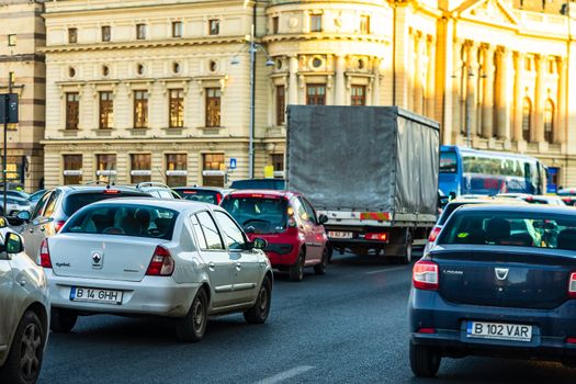 Car traffic at rush hour in downtown area of the city. Car pollution, traffic jam in the morning and evening in the capital city of Bucharest, Romania, 2020