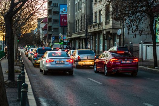 Car traffic at rush hour in downtown area of the city. Car pollution, traffic jam in the morning and evening in the capital city of Bucharest, Romania, 2020