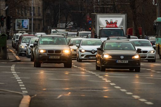 Car traffic at rush hour in downtown area of the city. Car pollution, traffic jam in the morning and evening in the capital city of Bucharest, Romania, 2020