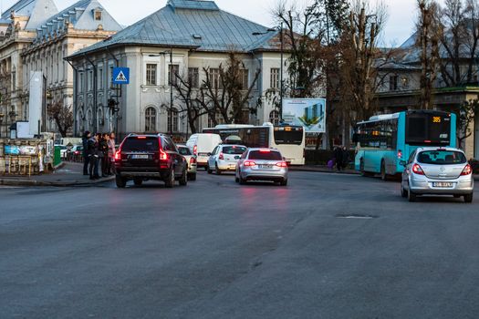 Car traffic at rush hour in downtown area of the city. Car pollution, traffic jam in the morning and evening in the capital city of Bucharest, Romania, 2020