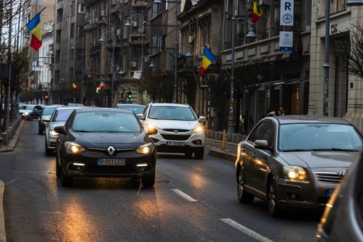 Traffic at rush hour in downtown Bucharest. Junction with stopped cars waiting for green light in Bucharest, Romania, 2020