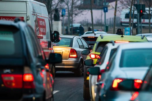 Traffic at rush hour in downtown Bucharest. Junction with stopped cars waiting for green light in Bucharest, Romania, 2020