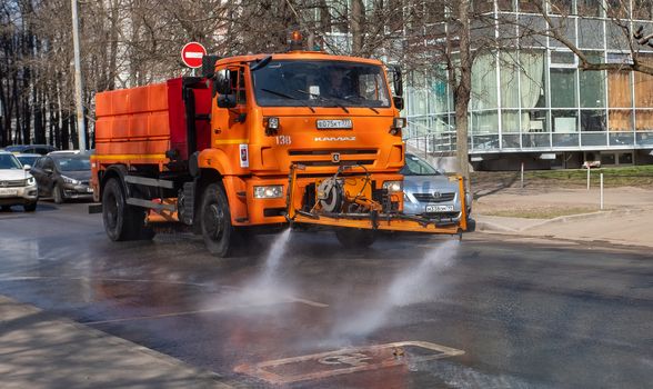 March 28, 2020, Moscow, Russia. Municipal equipment performs sanitary treatment of the street.