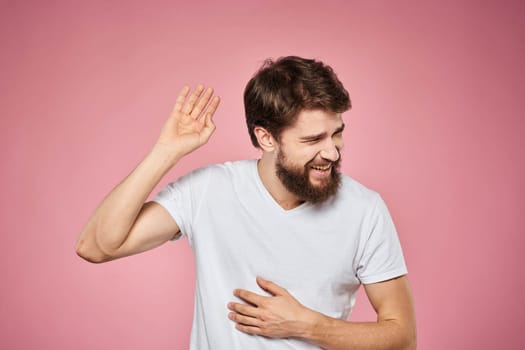 cheerful bearded man white t-shirt emotions cropped view pink background. High quality photo