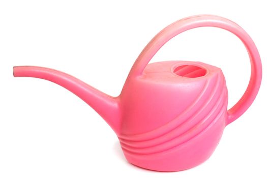 Old dirty pink plastic watering can, isolated standing on a white background