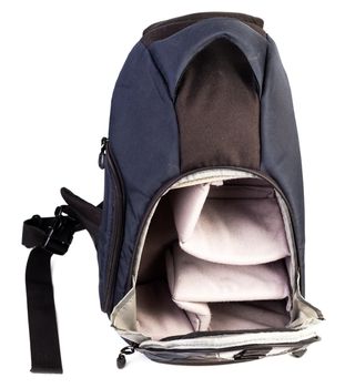 Used black and blue fabric camera bag isolated on white background.