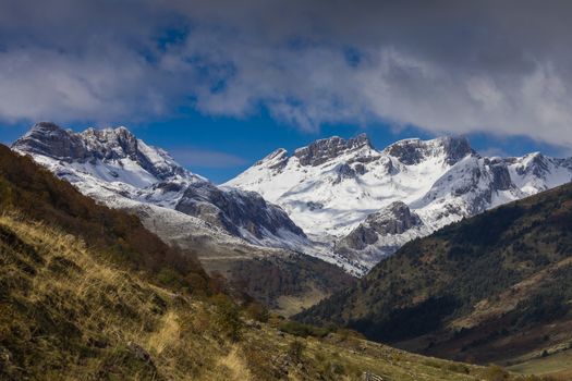 Snowy mountains landscape in the Aragonese Pyrenees. View of the Guarrinza pastures, near the Barcal ravine and Aguas Tuertas valley, Hecho and Anso, Huesca, Spain.