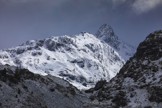 Snowy mountains landscape in the Aragonese Pyrenees. Near of Aguas Tuertas valley, Hecho and Anso, Huesca, Spain.