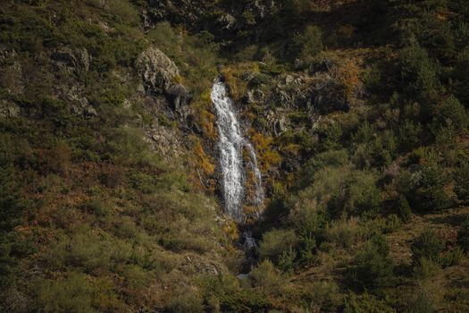 Cascade of cold and icy water. Aragonese Pyrenees, near of Aguas Tuertas valley, Hecho and Anso, Huesca, Spain.