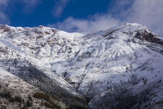 Snowy mountains landscape in the Aragonese Pyrenees. Near of Aguas Tuertas valley, Hecho and Anso, Huesca, Spain.