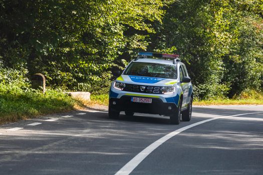 Romanian Police new Dacia Duster car in motion on asphalt road, front view of police car in Arges, Romania, 2020