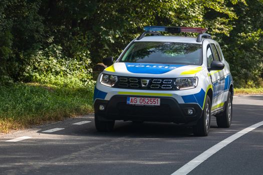 Romanian Police new Dacia Duster car in motion on asphalt road, front view of police car in Arges, Romania, 2020