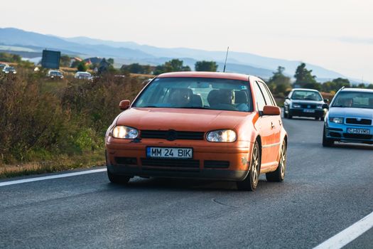 Traveling car in motion on asphalt road, front view of car on street. Bucharest, Romania, 2020