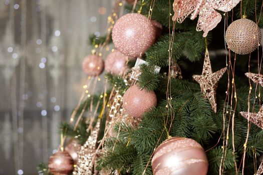 Christmas tree blur garland close-up New year background Decoration with snow and branch of Christmas tree