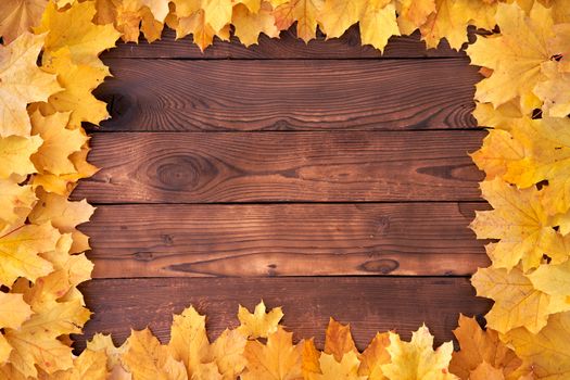 Autumn leaves Square frame on wooden background top view Fall Border yellow and Orange Leaves vintage wood table Copy space for text