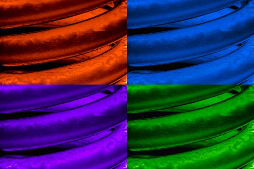 set of colored CFL neon light bulbs on black background.