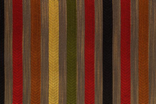 Vertically striped flat polyester upholstery dark colored texture and background
