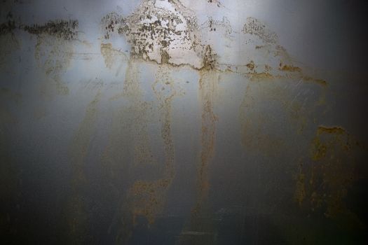 real thin flat sheet metal background with dark corners and light stains of rust