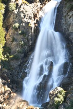 The Rutor waterfall, in Valle d'Aosta, descends impetuously among the rocks