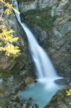 The Rutor waterfall, in Valle d'Aosta, descends impetuously among the rocks