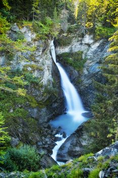 The Rutor waterfall, in Valle d'Aosta, descends impetuously among the rocks