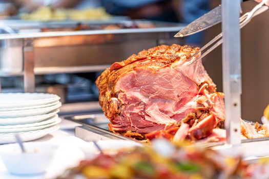 roast pork ham on a catering table.