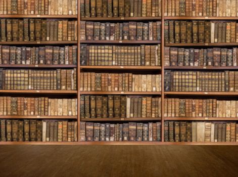 Defocused and blurred image of old antique library books on shelves with wooden floor for use in video conferencing background