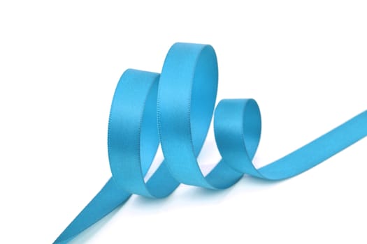 Curl of blue beautiful Satin silk holiday ribbon on a white background. copy Space for text.