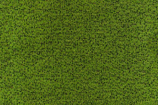 Seamless texture of flat green synthetic furniture upholstery with motley fine details.