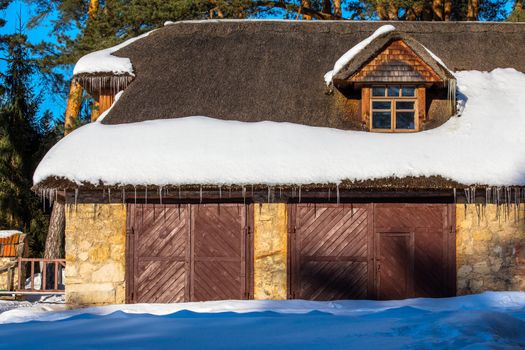 Spring barn with straw roof and mansard.