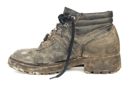 Right one dirty worn-out old work boot, isolated on white background with shadow.