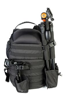 Black professional tactical molle black photo backpack with tripod and panoramic head isolated on white background.