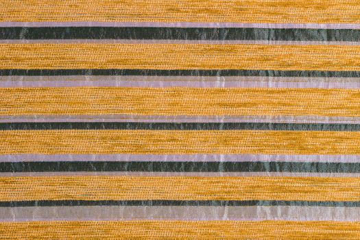 orange striped synthetic woven upholstery fabric close-up texture and background