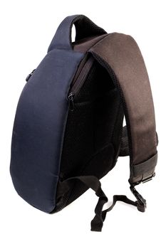 Used black and blue fabric camera bag isolated on white background with selective focus.