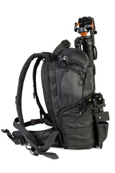 Black professional tactical molle black photo backpack with tripod and panoramic head isolated on white background.